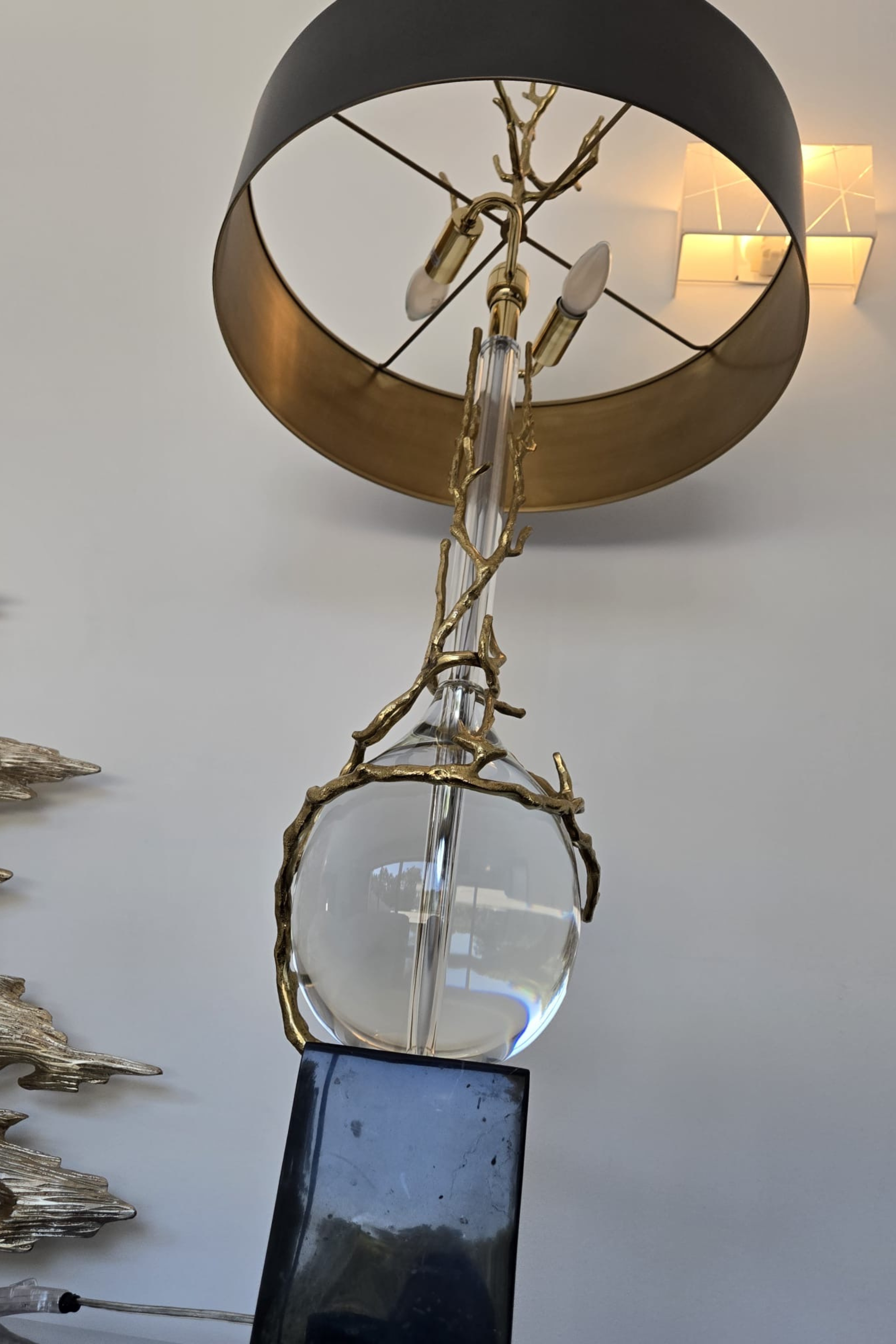 Pair of sculptural brass and glass table lamps with black metal shades by Marina Fogg, showcasing elegant design and modern craftsmanship.