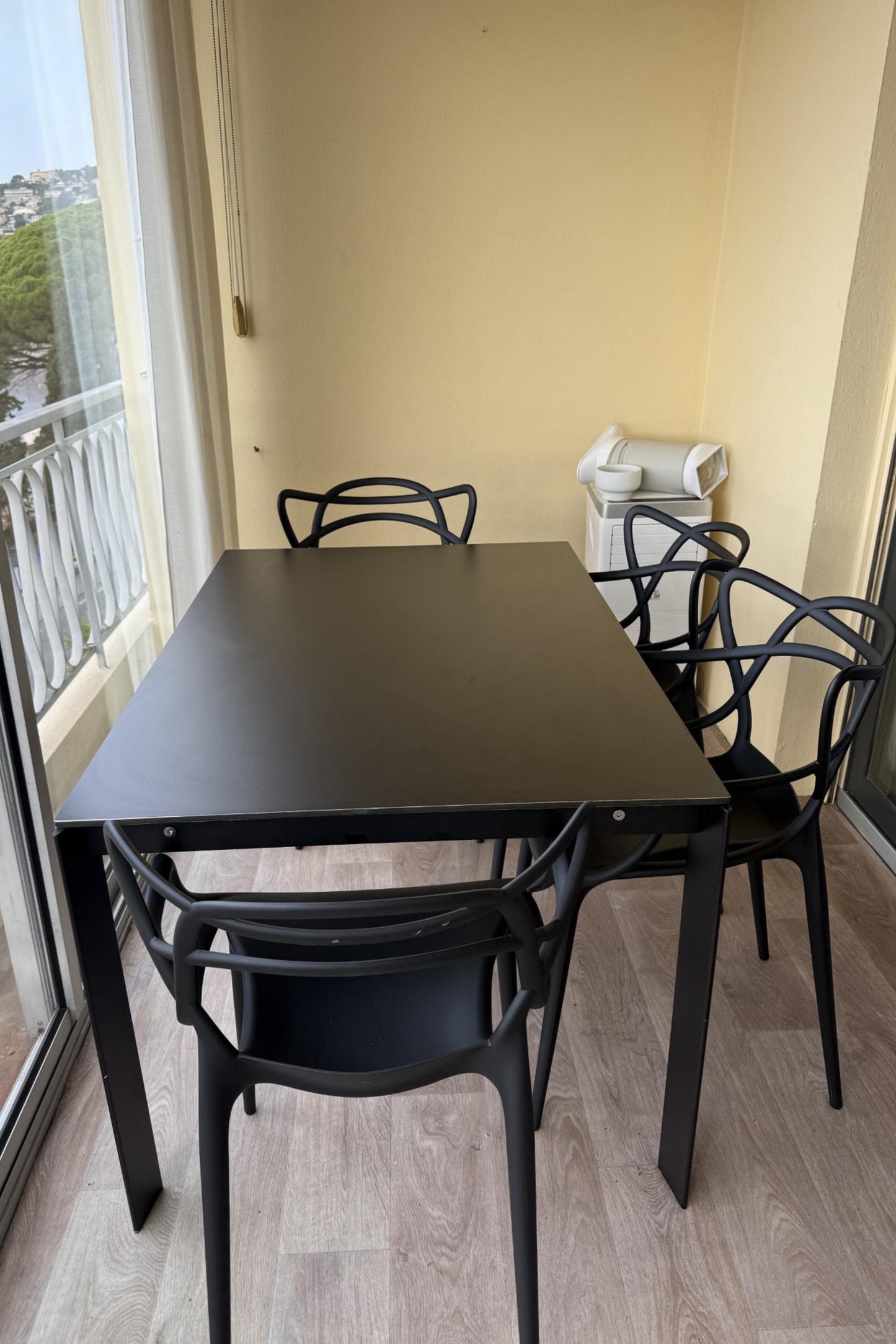 Desalto dining table with Kartell chairs