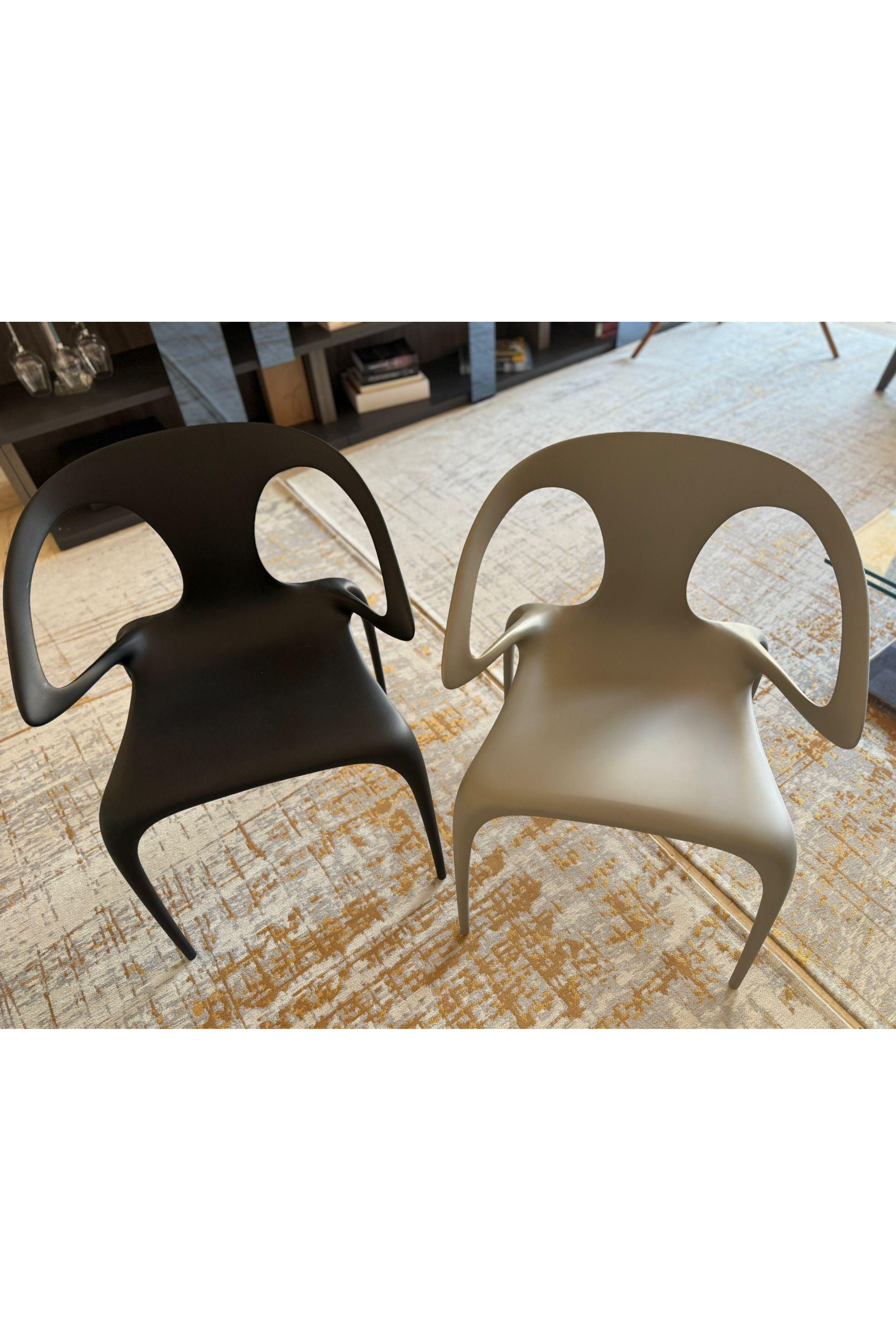 Set of four Roche Bobois Ava dining chairs by Serpil Barrington-Serle, featuring modern design with upholstered seats and sleek legs.