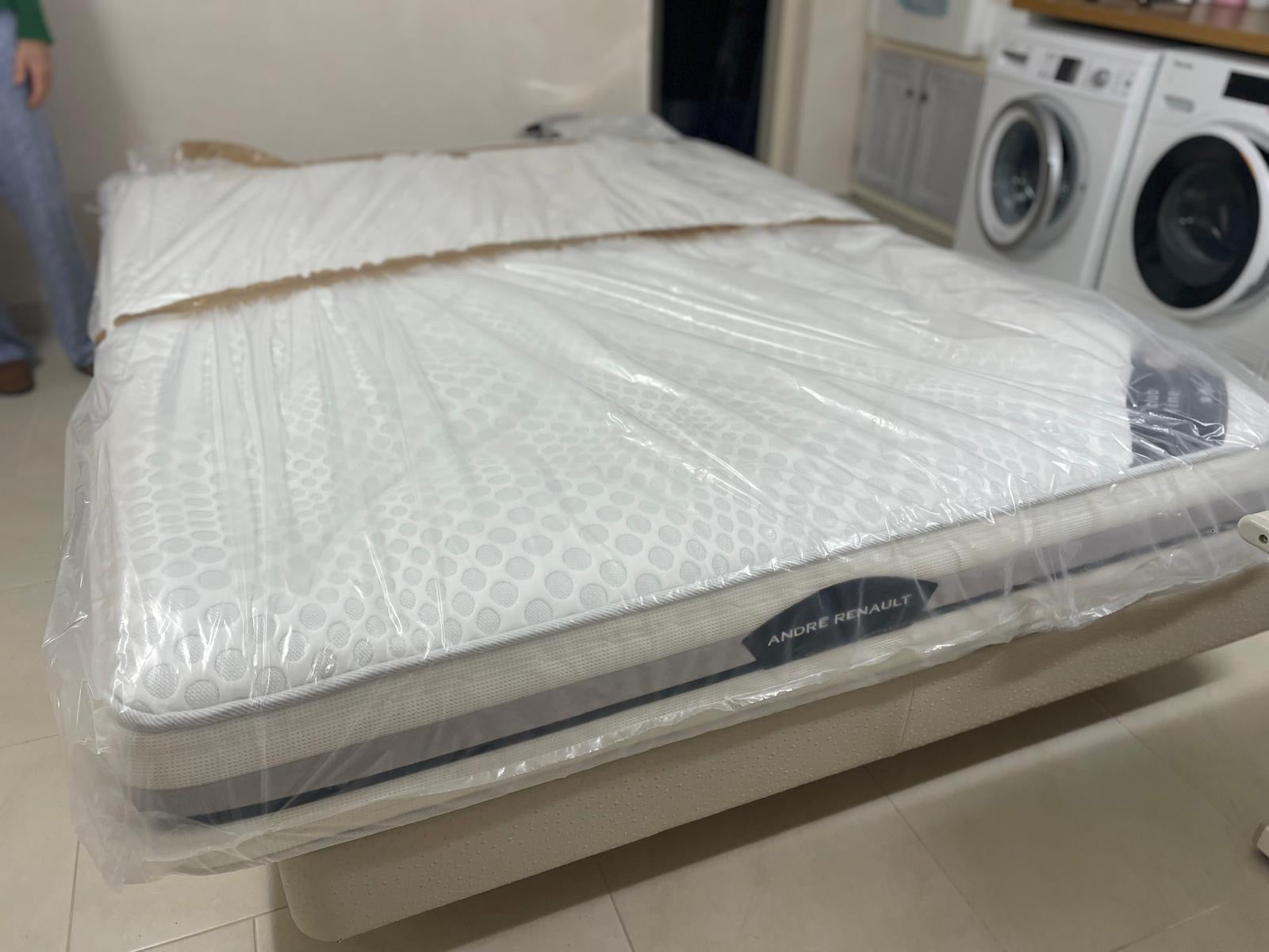 Double bed with mattress from Reserve by Meublesmonaco, featuring a modern headboard and cozy bedding setup.