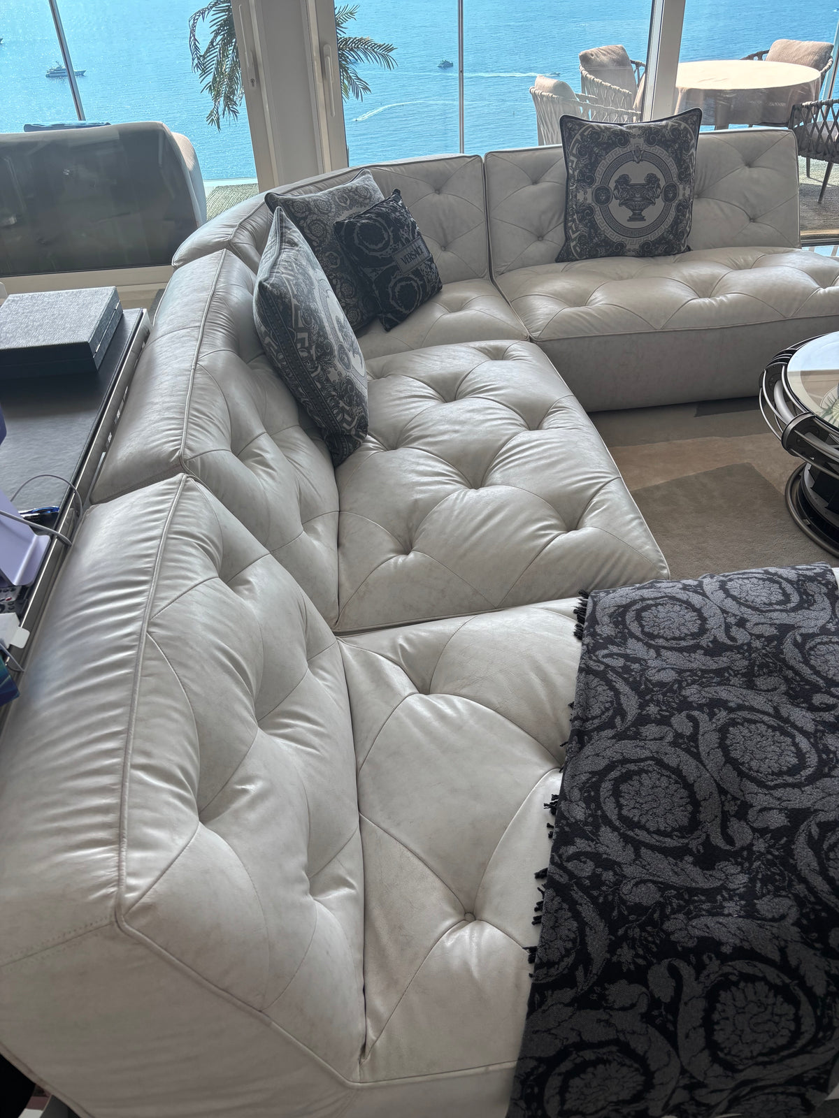 Timothy Oulton leather sofa from above, showing the tufted seats and corner section