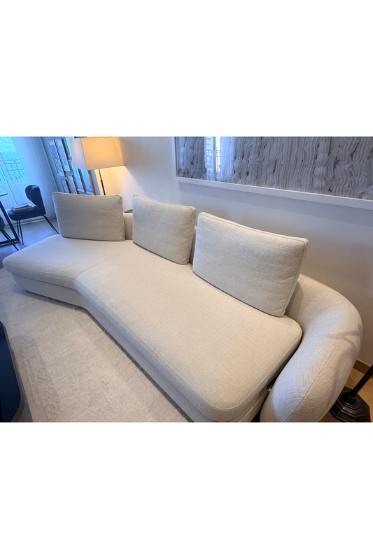 Cream Poliform sofa by Alexia Brianti, showcasing plush upholstered seating with sleek modern design and clean lines.