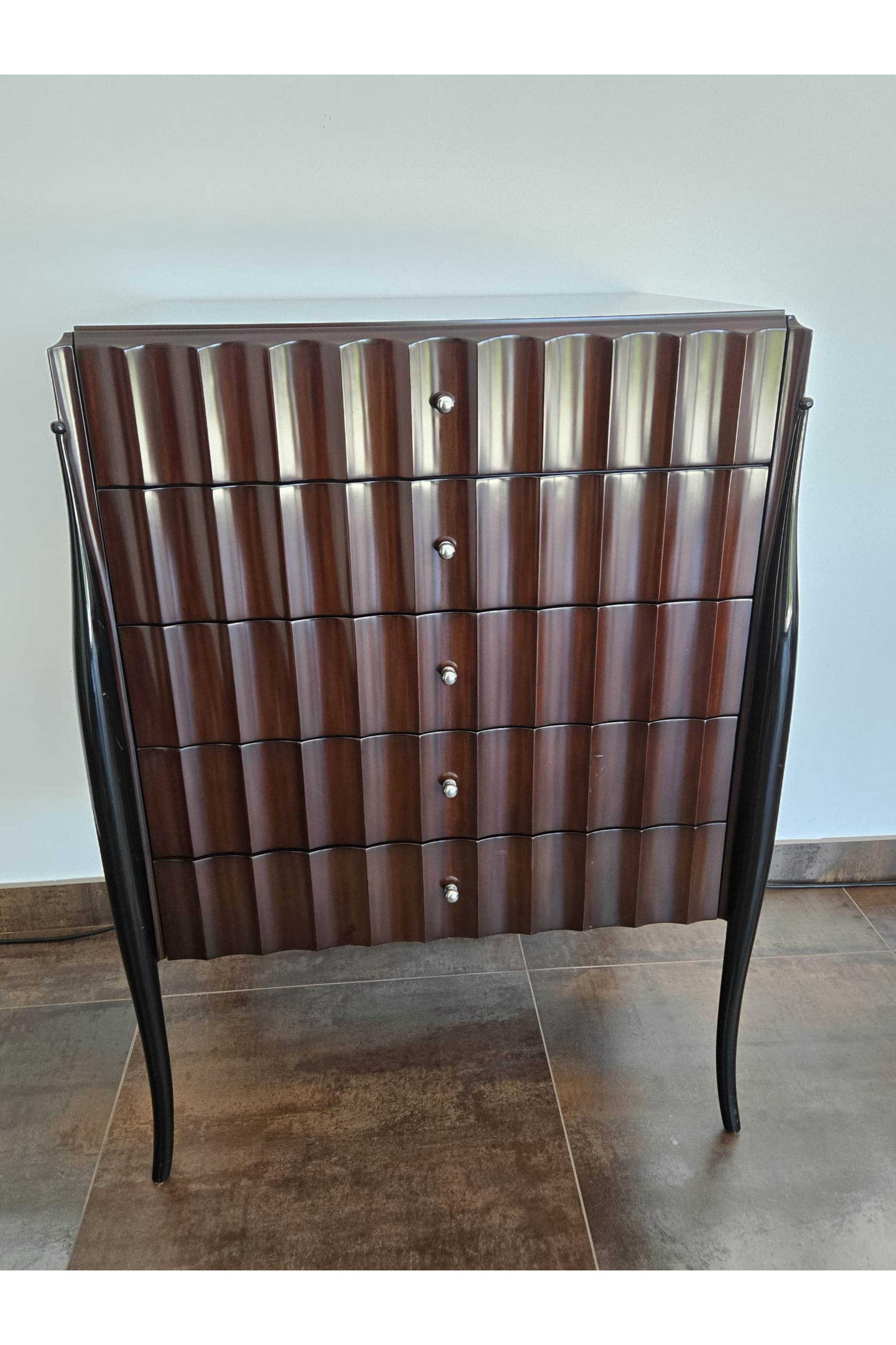 Marina Fogg Allegra sculptural chest of drawers with curved wood front and statement design, showcasing modern craftsmanship and elegant style.