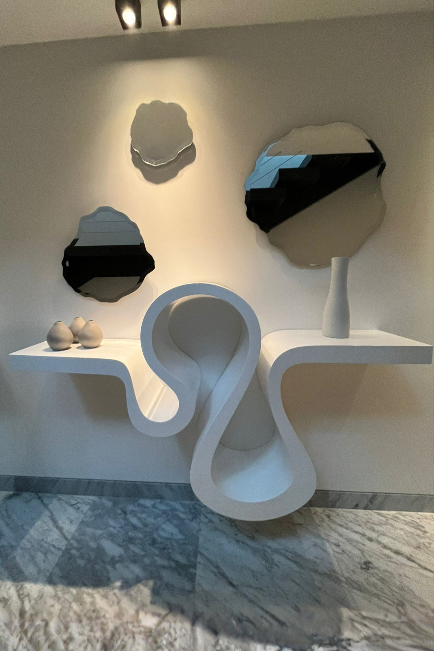 Sculptural White Consoles
