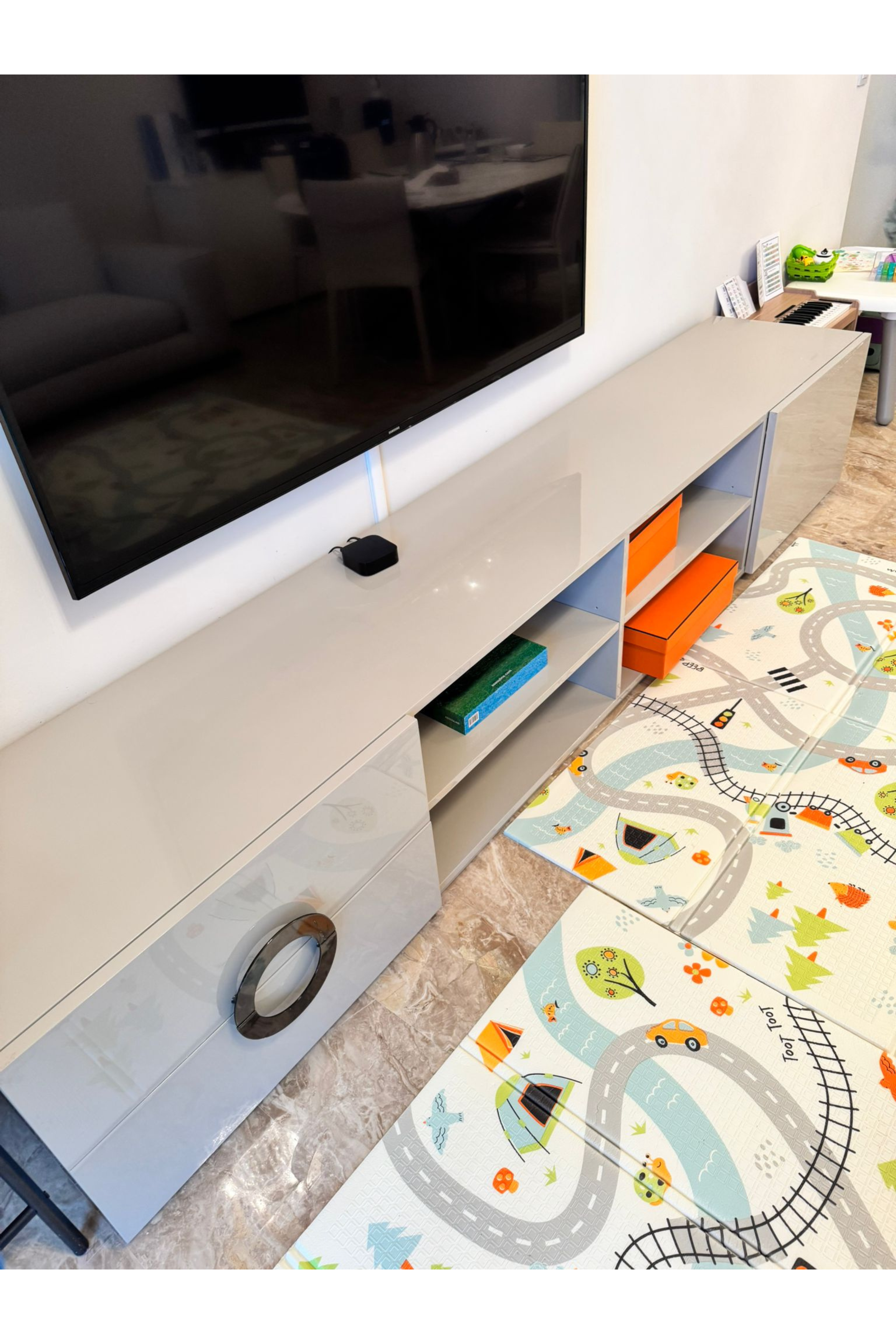 Contemporary gloss TV unit in Minotti style with sleek white finish, modern design, and spacious storage compartments.