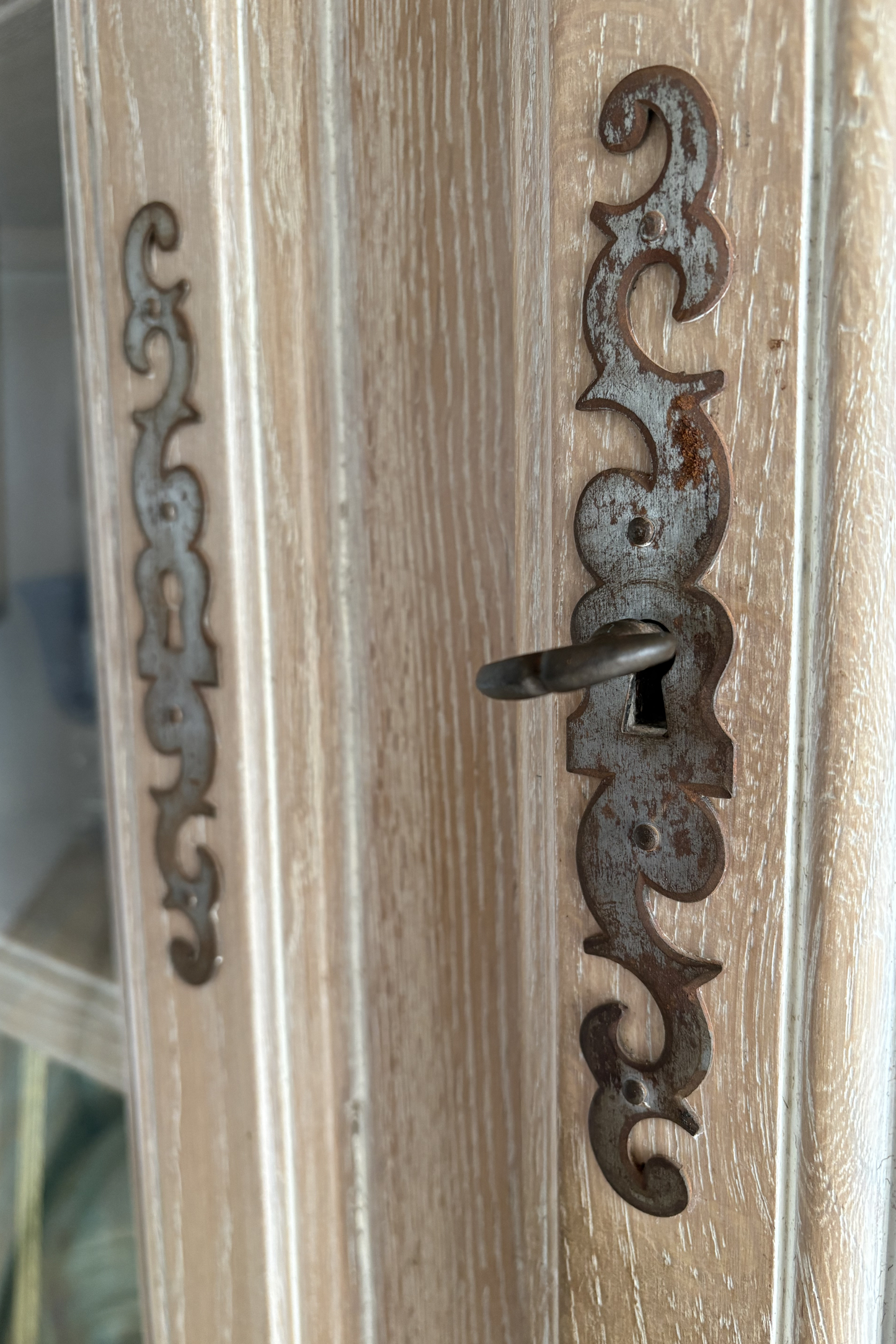 Solid ash corner drinks cabinet by Frances Bilham, featuring glass display doors and interior shelving for stylish storage.