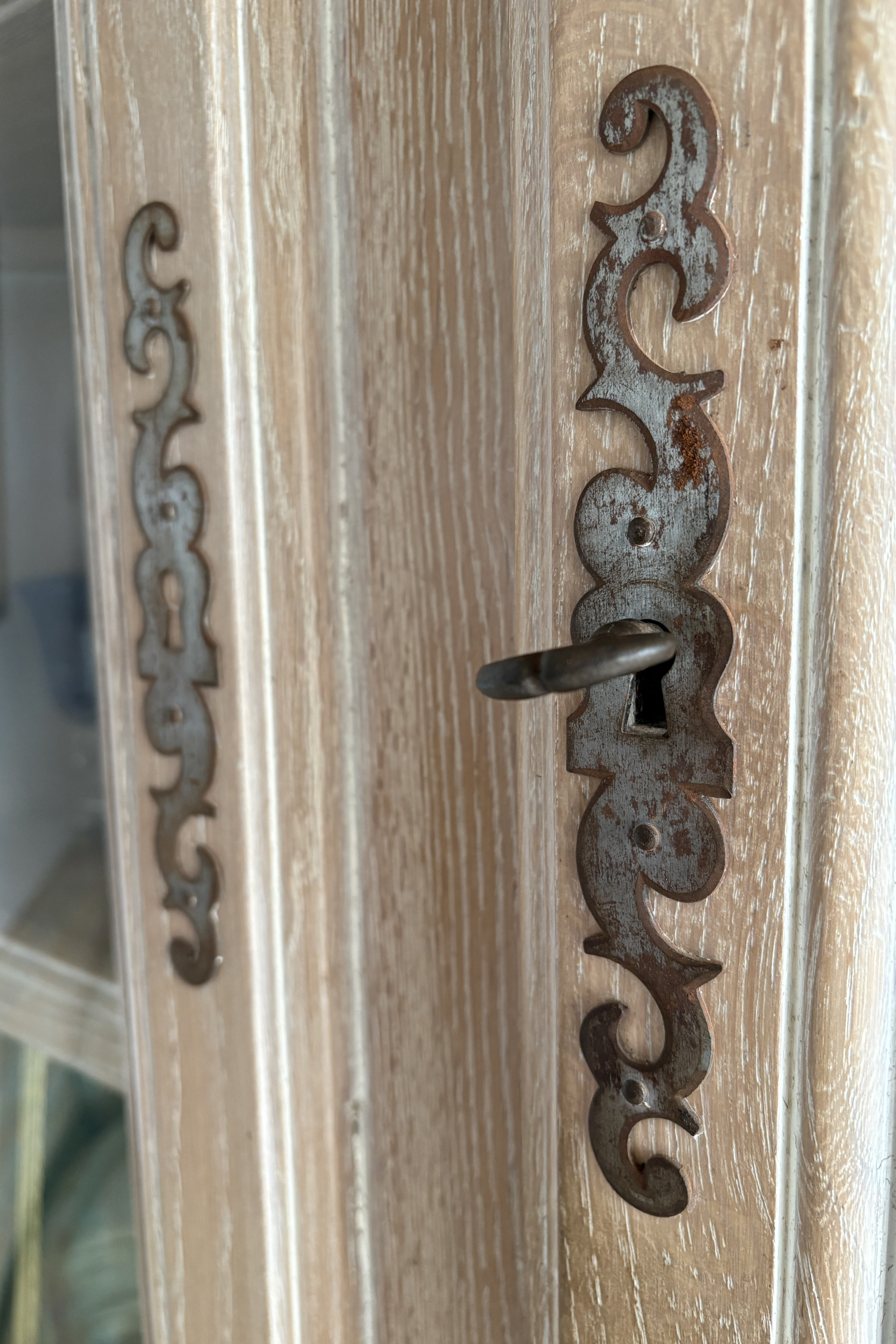Solid ash corner drinks cabinet by Frances Bilham, featuring glass display doors and interior shelving for stylish storage.