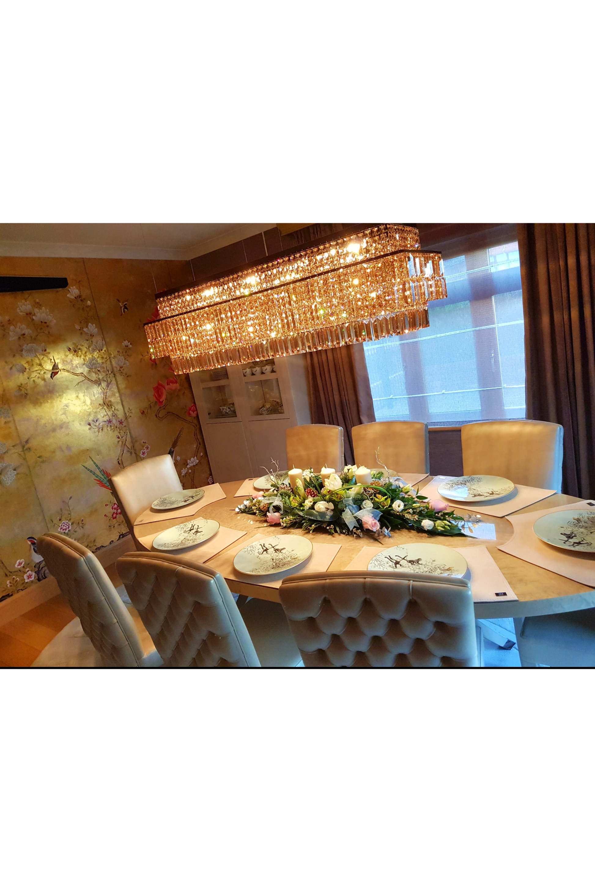 Fendi Casa dining table with eight matching chairs, elegant wooden set by Marina Fogg, showcasing a modern dining room setup.