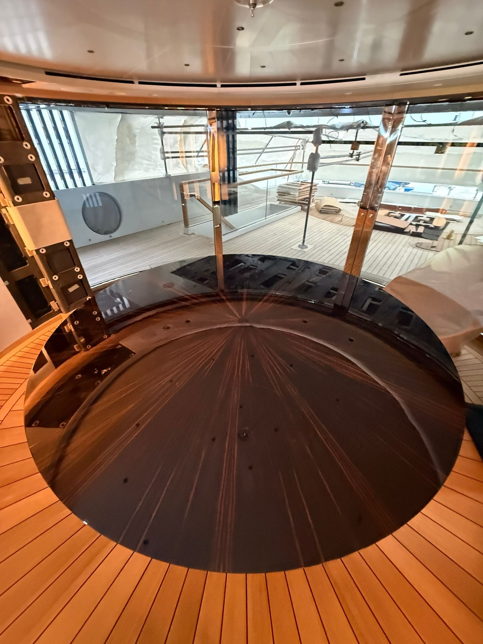 Custom yacht dining table by Ilyana Popova, 250cm diameter, showcasing a sleek, bespoke design with polished wood finish.