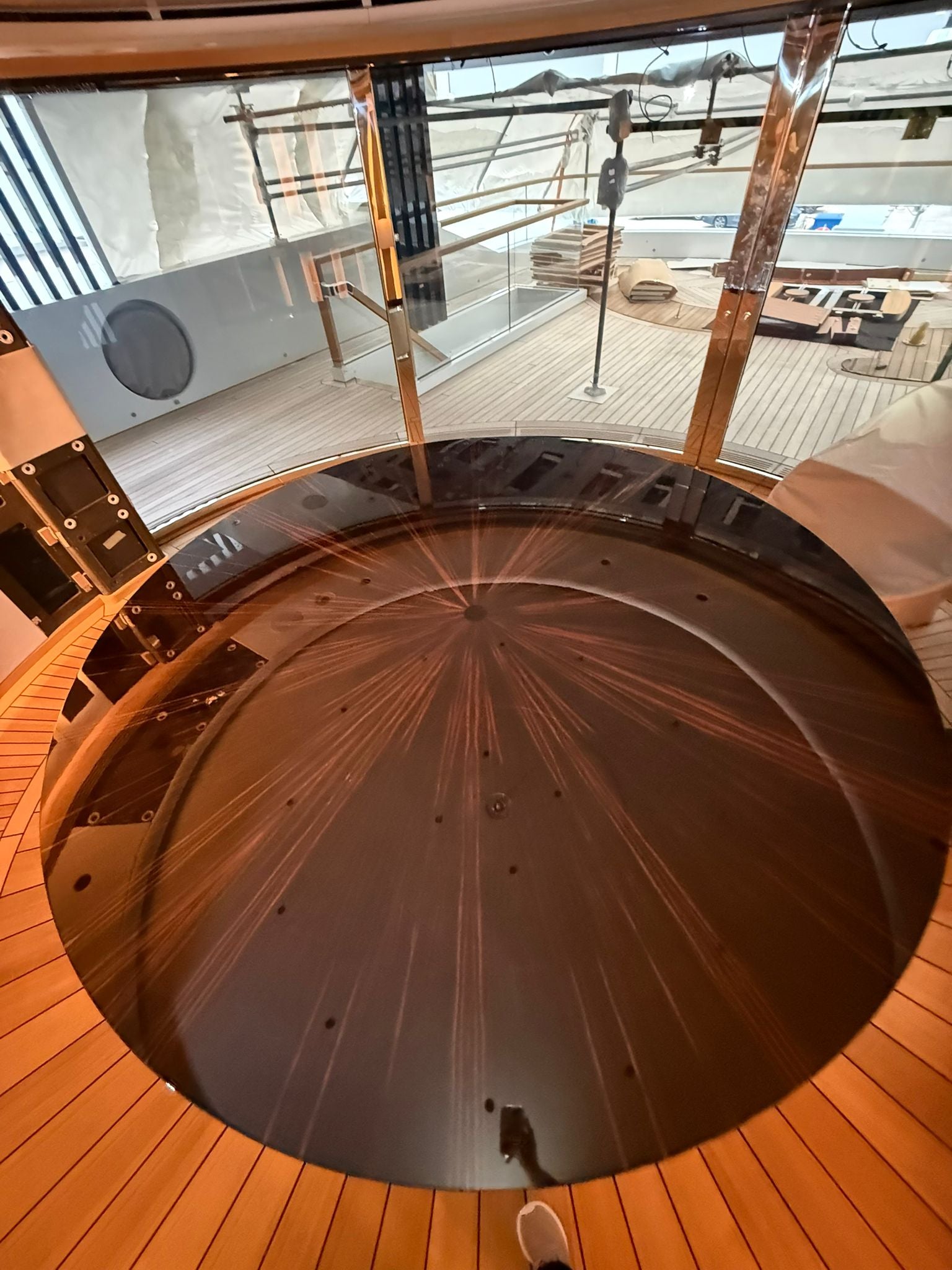 Custom yacht dining table by Ilyana Popova, Ø250 cm, showcasing a luxurious, handcrafted bespoke piece for marine interiors.
