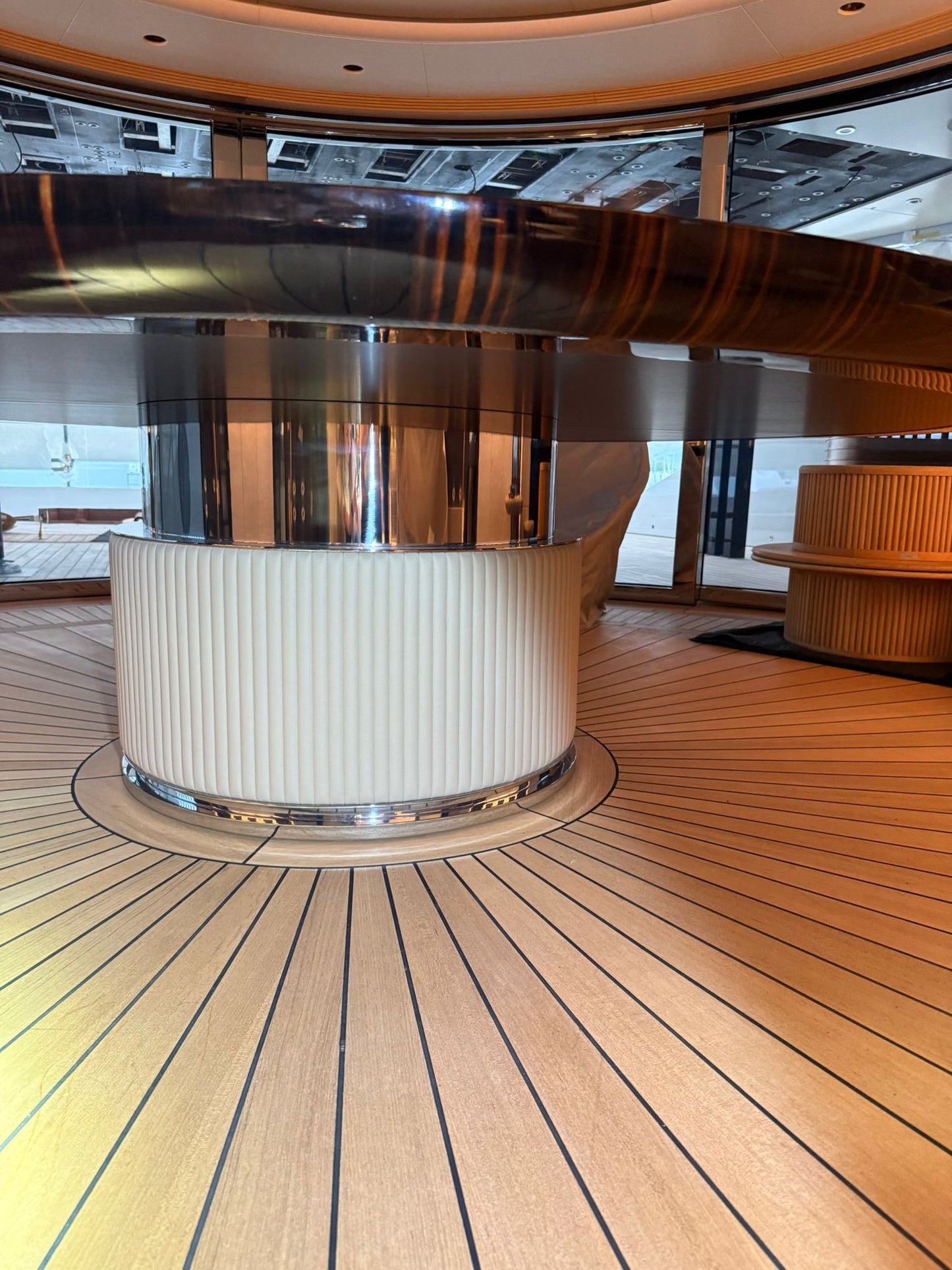 Custom Ilyana Popova yacht dining table with a 250cm diameter, showcasing its elegant bespoke design and polished surface.
