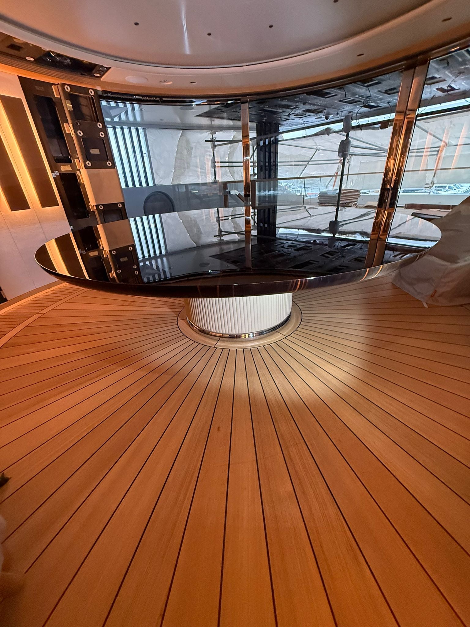 Custom yacht dining table by Ilyana Popova, large 250 cm diameter bespoke wood dining table for luxury marine interiors.
