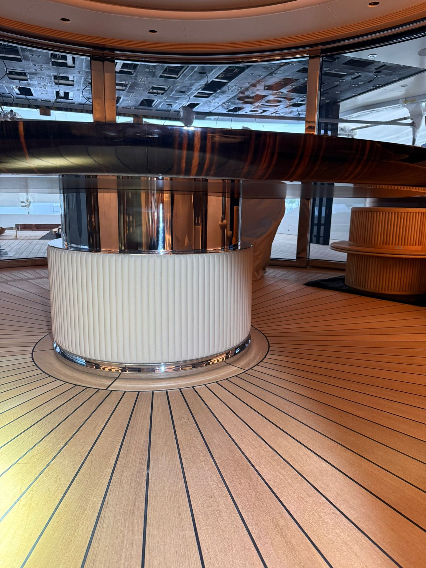 Custom yacht dining table by Ilyana Popova, 250 cm diameter, featuring elegant bespoke design for luxurious maritime interiors.