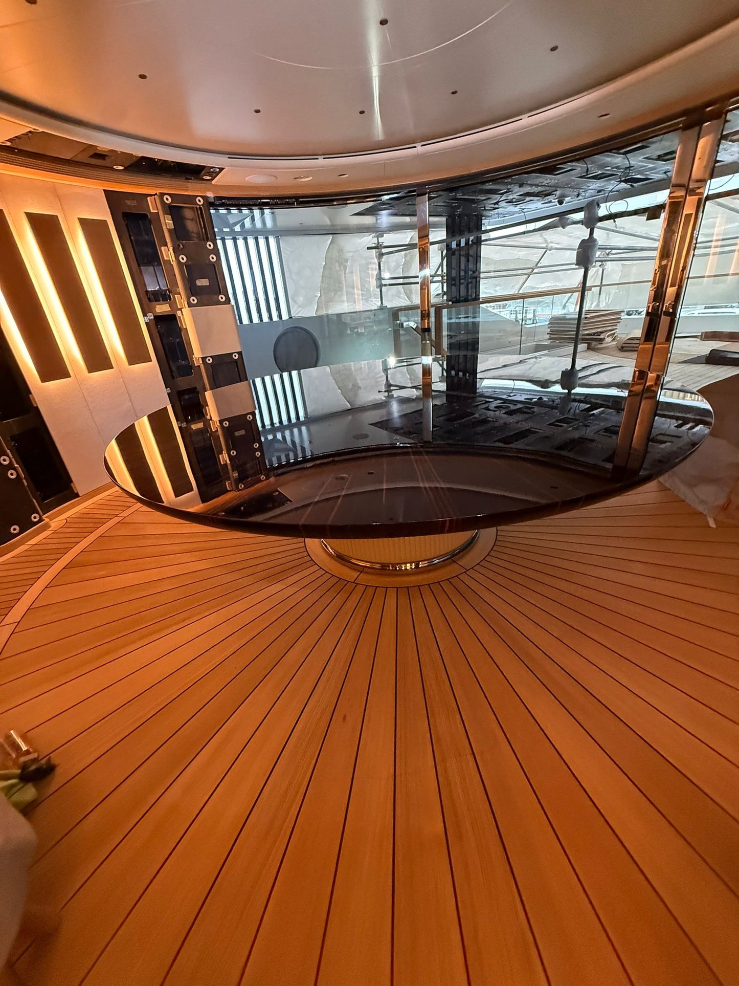 Custom yacht dining table by Ilyana Popova, 250cm diameter, showcasing a sleek, bespoke design with polished wood surface.