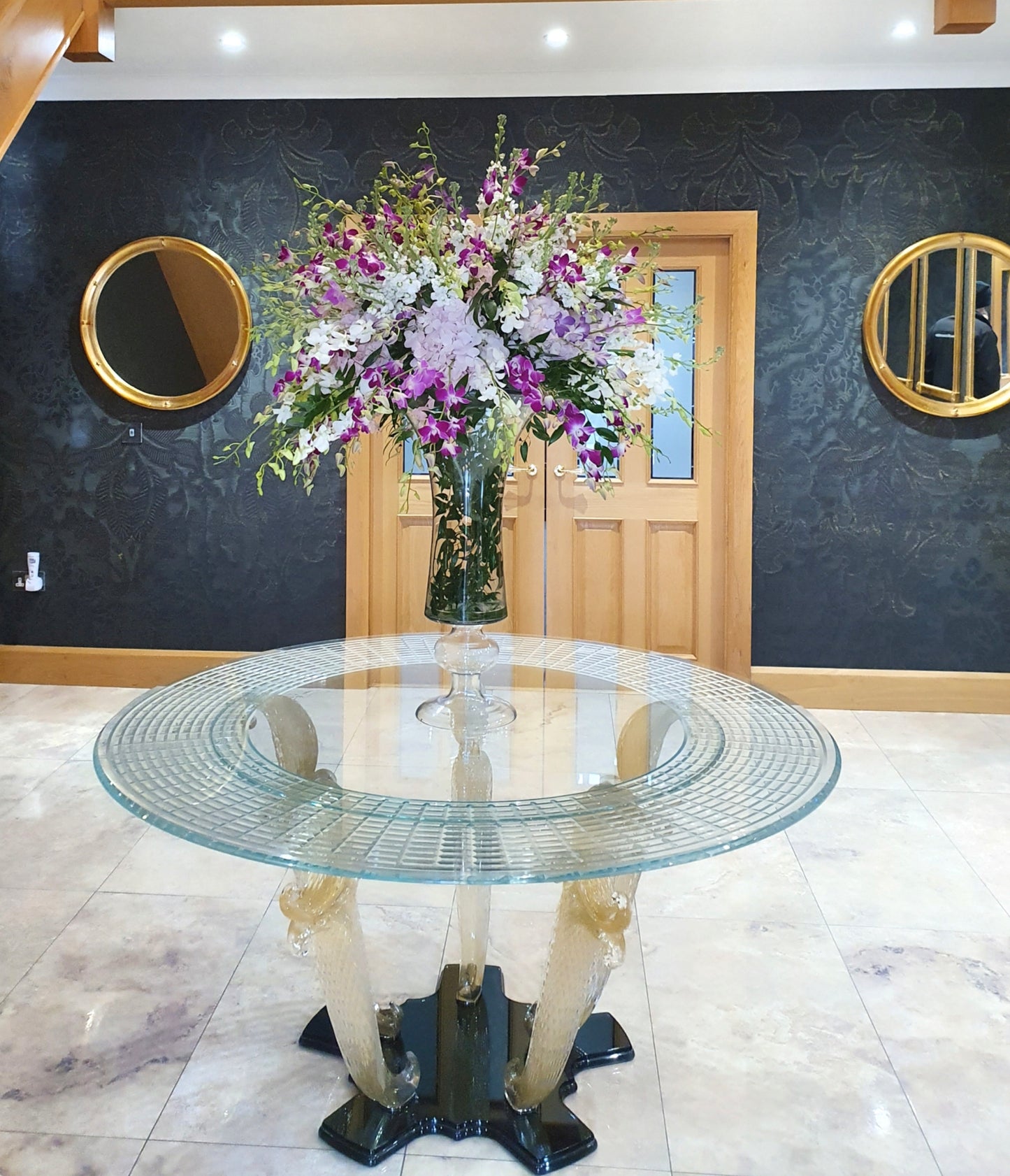 Marina Fogg Reflex Casanova 72 dining table with Murano glass top and gold leaf accents, showcasing elegant craftsmanship.