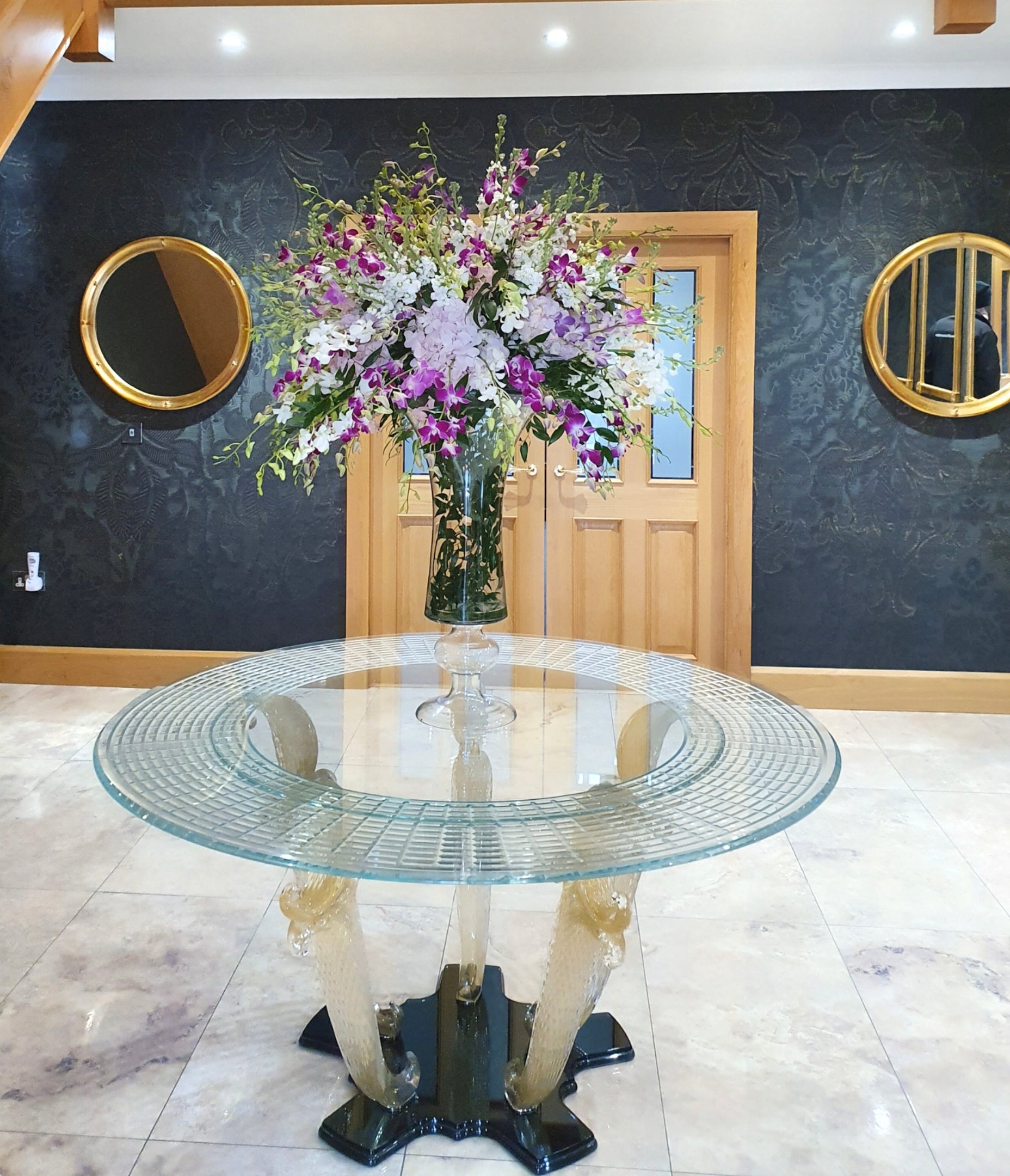 Marina Fogg Reflex Casanova 72 dining table with Murano glass top and gold leaf accents, showcasing elegant craftsmanship.
