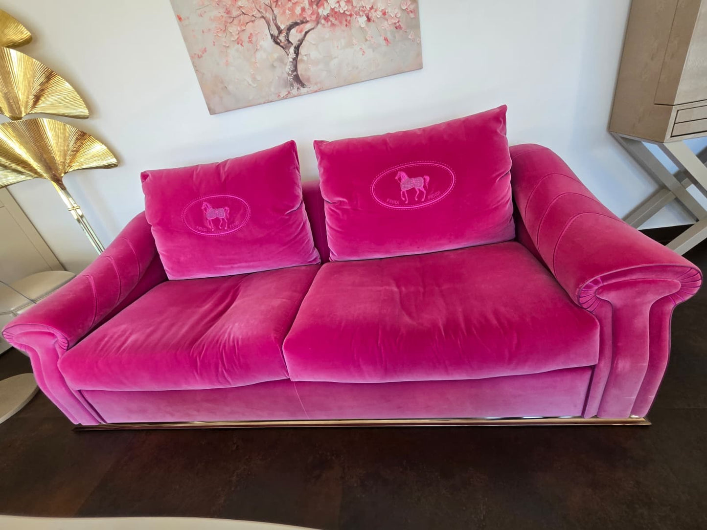 Pink velvet Fendi Casa sofa with modern design, highlighted as a statement piece in a stylish living room setting.