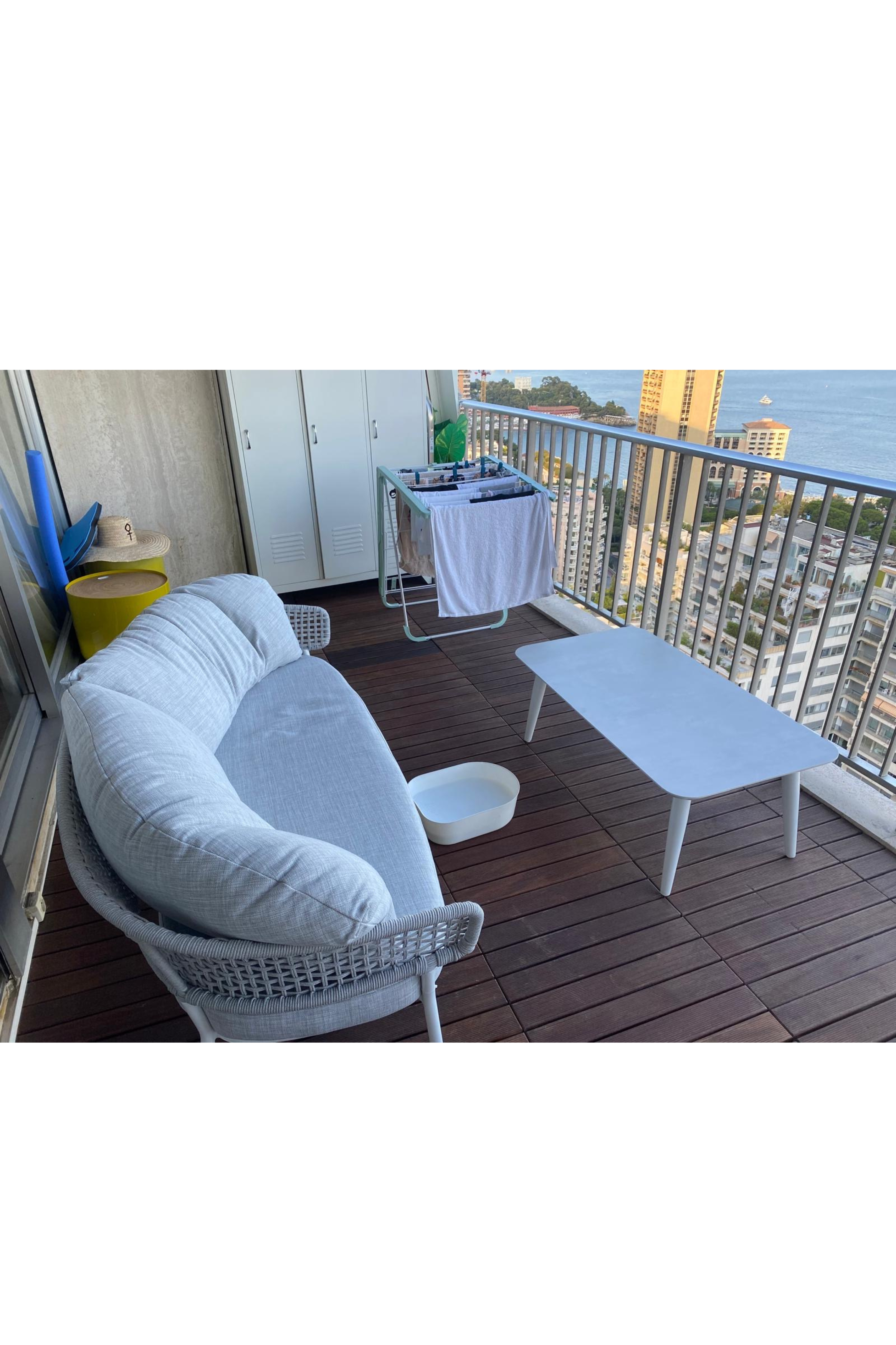 Melanie Gouchon Talenti Moon Alu outdoor lounge set with sofa, armchair, and coffee table in a modern patio setting
