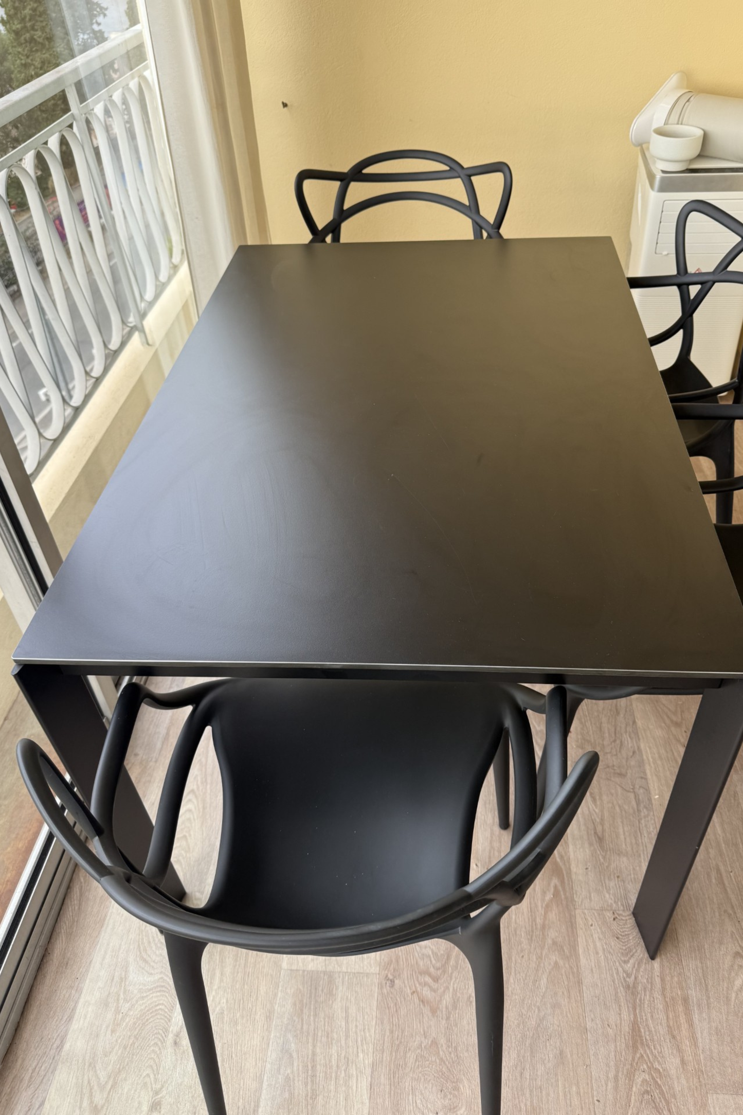 Desalto dining table with Kartell chairs