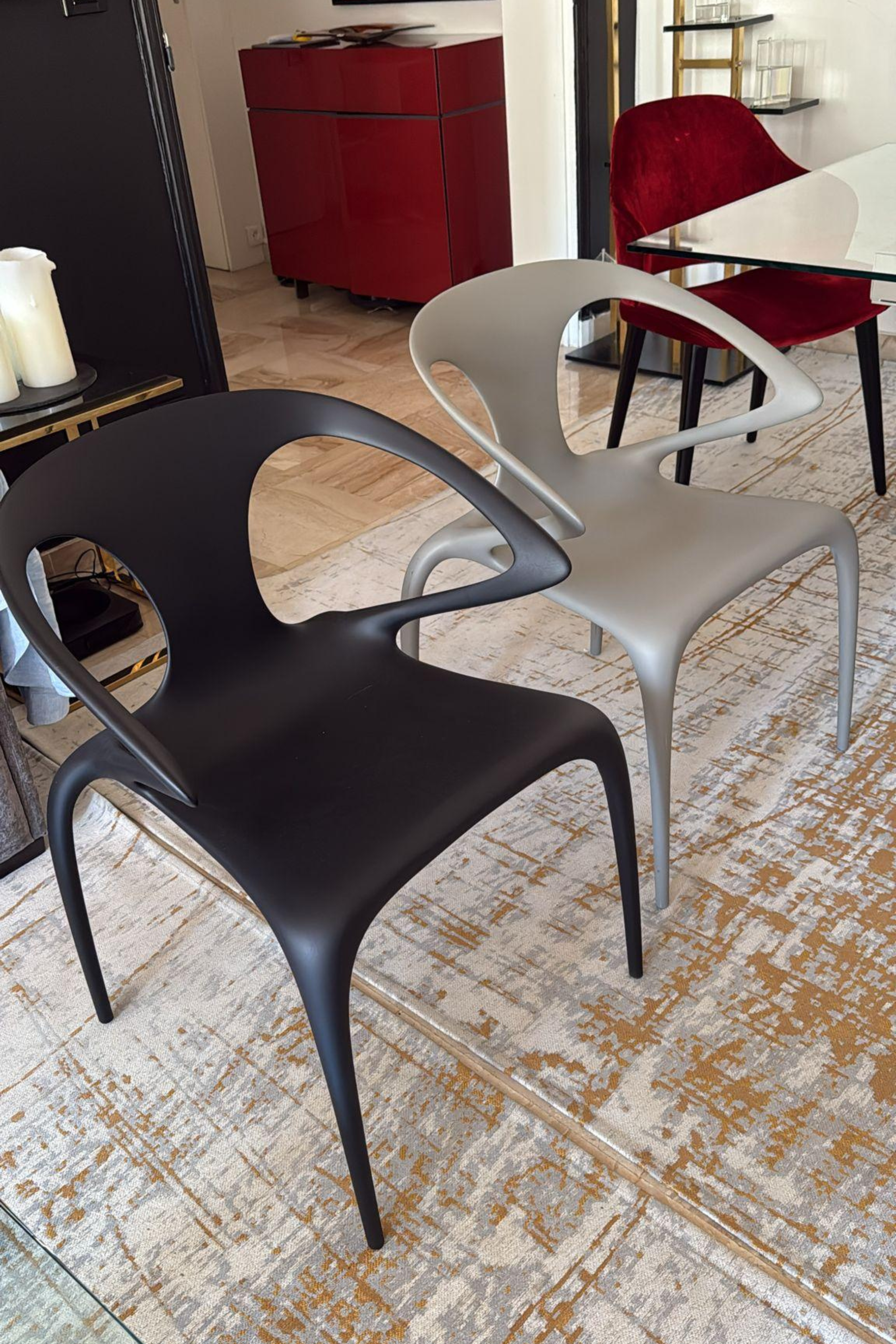 Set of four Roche Bobois Ava dining chairs by Serpil Barrington-Serle, featuring modern design and sleek wooden legs.