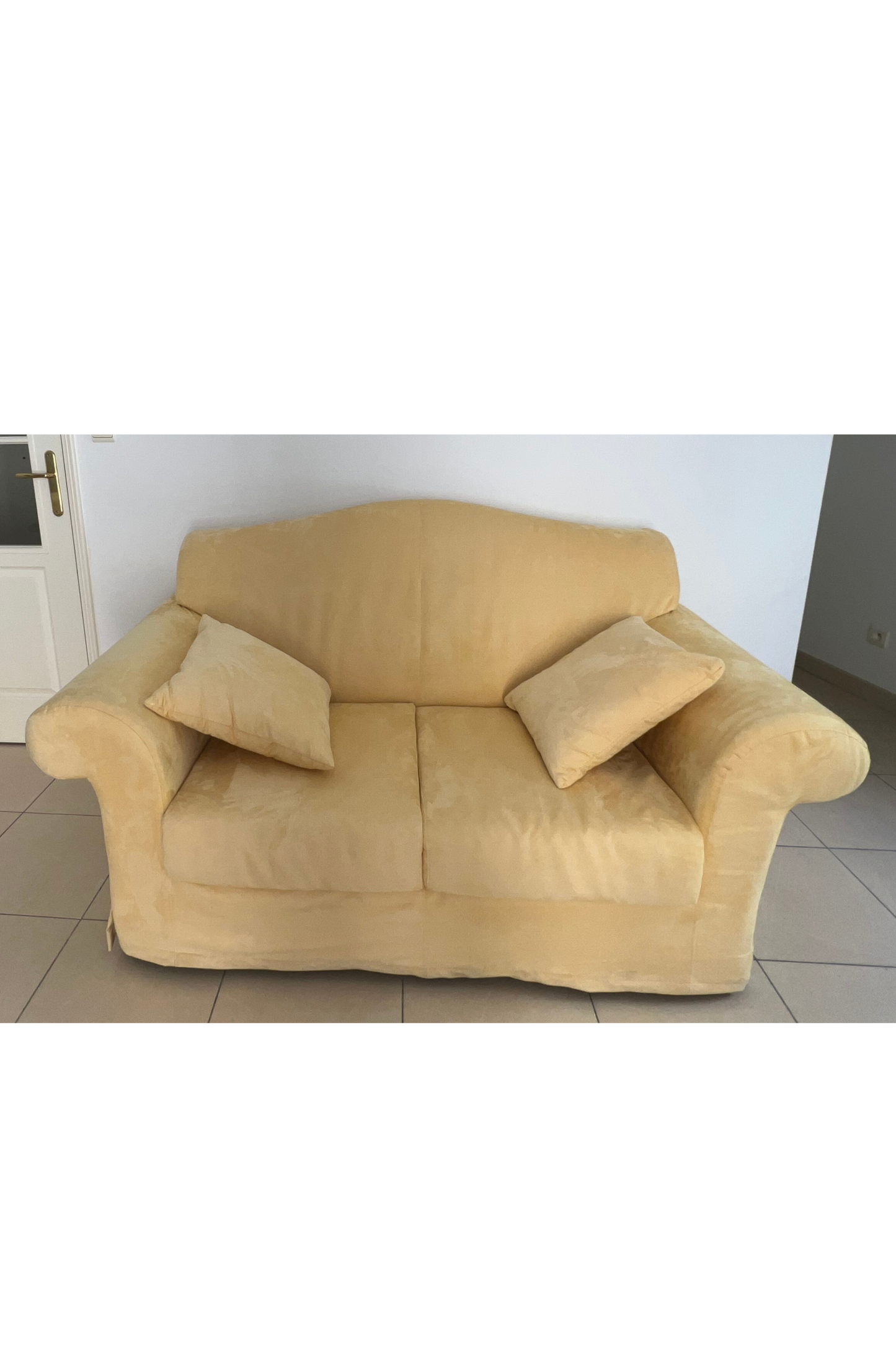 Yellow velvet-style small double sofa bed by Luca Orrù, showing plush upholstery and compact design for versatile living spaces.