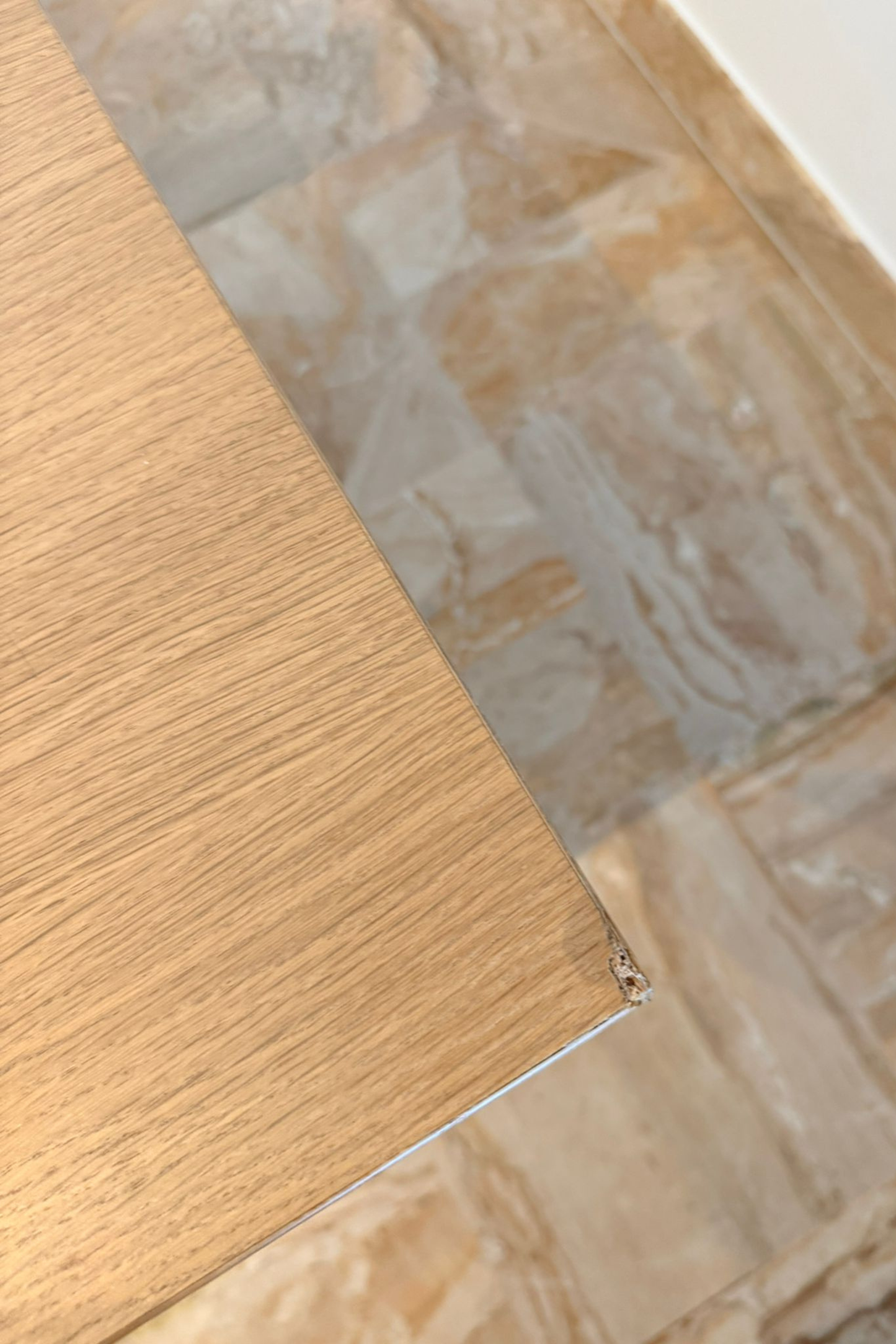 Wood veneer dining table by Charlotte Isackson with smooth wooden surface and sturdy legs, perfect for modern dining rooms.