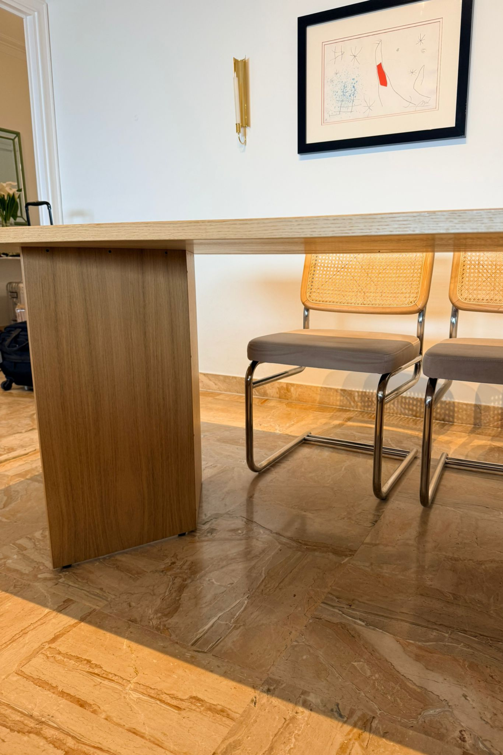 Elegant wood veneer dining table by Charlotte Isackson with a smooth tabletop and sturdy legs, perfect for modern dining spaces.