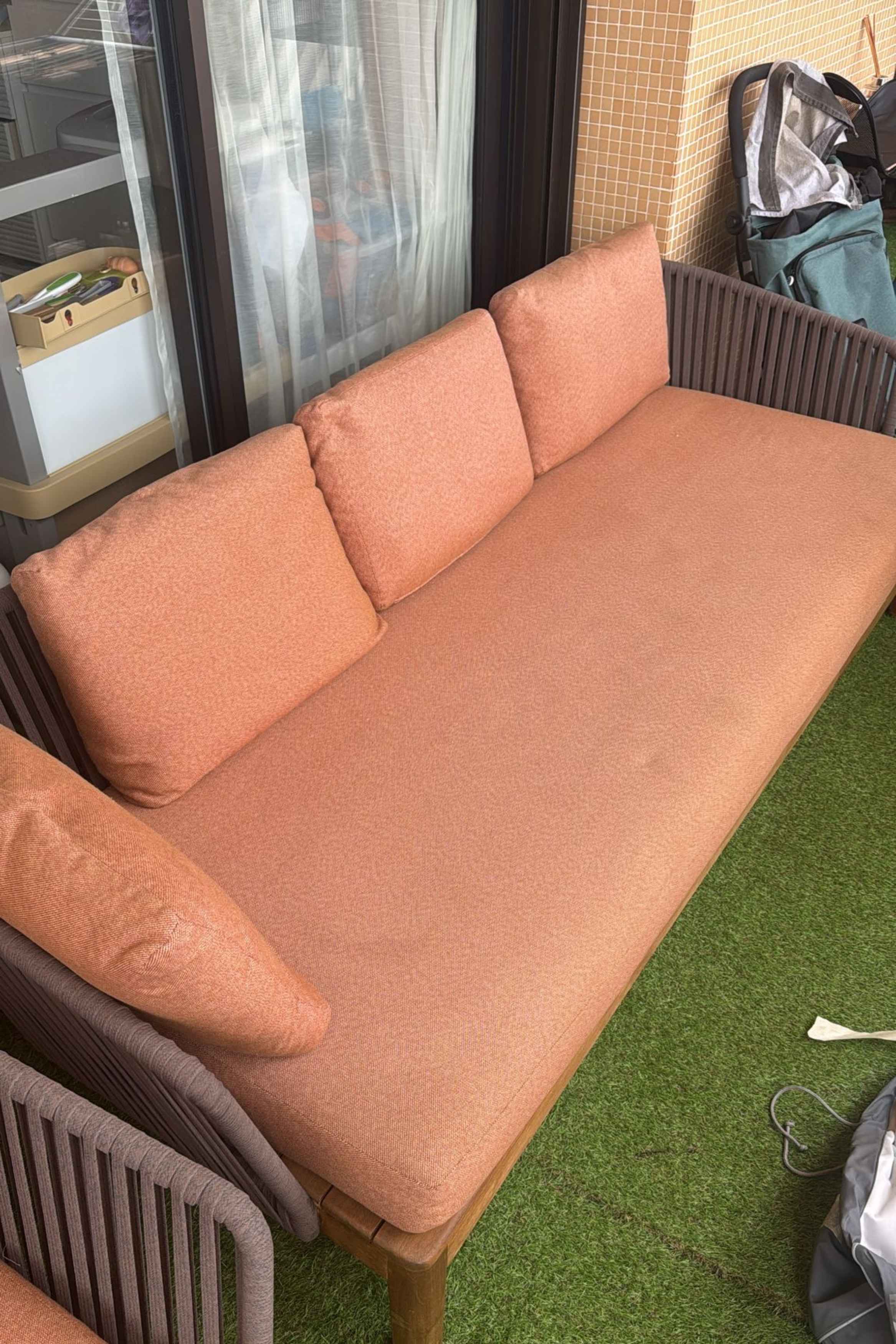 Anastasia Tarutova Tribu outdoor lounge set with two sofas and armchair, featuring matching covers, for stylish outdoor seating.