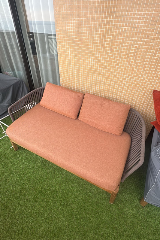 Outdoor lounge set by Anastasia Tarutova featuring two sofas and an armchair with covers, ideal for patio relaxation.