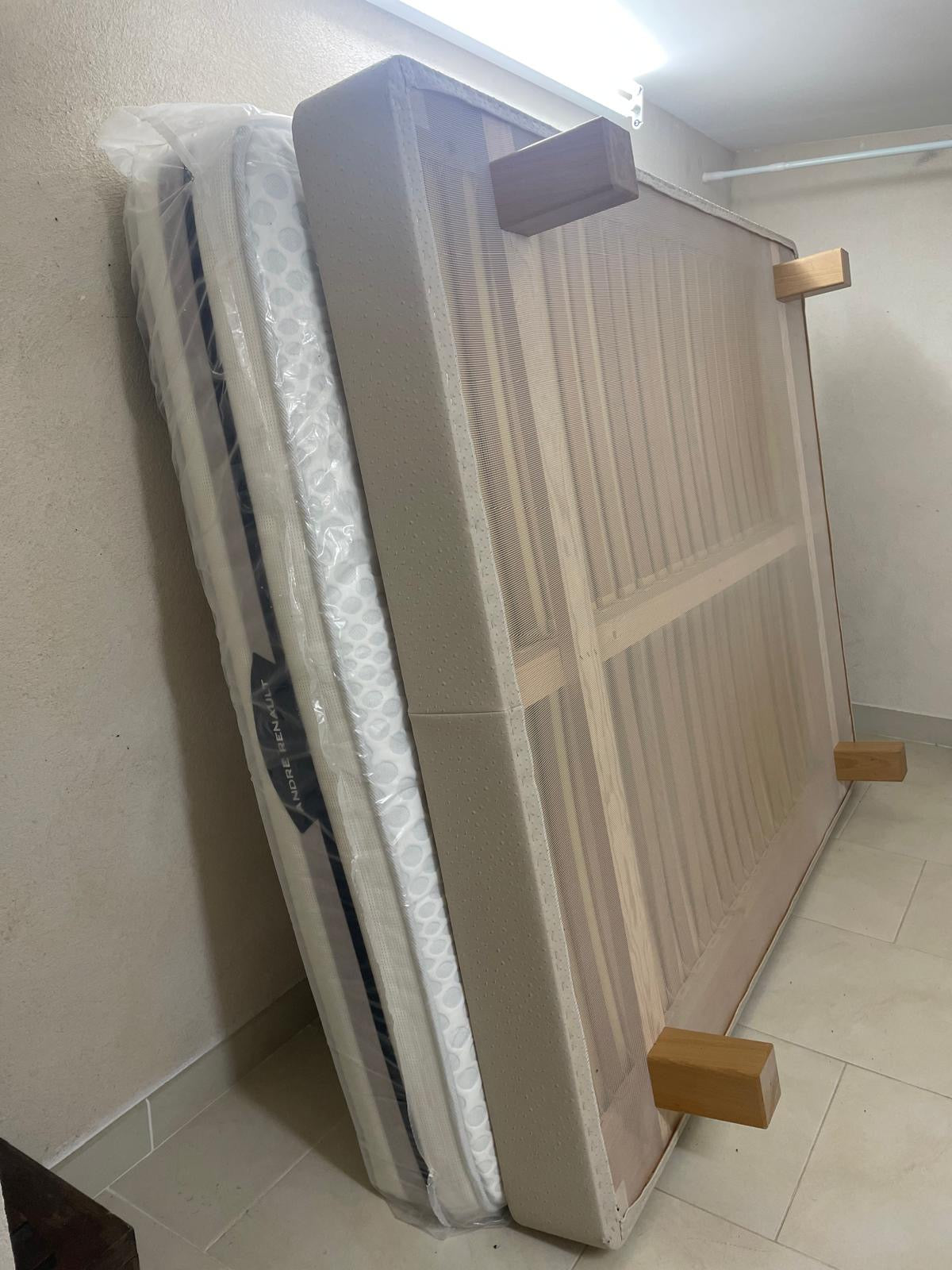 Double bed with mattress from Reserve by Meublesmonaco.com, featuring a modern wooden frame and comfortable bedding setup.