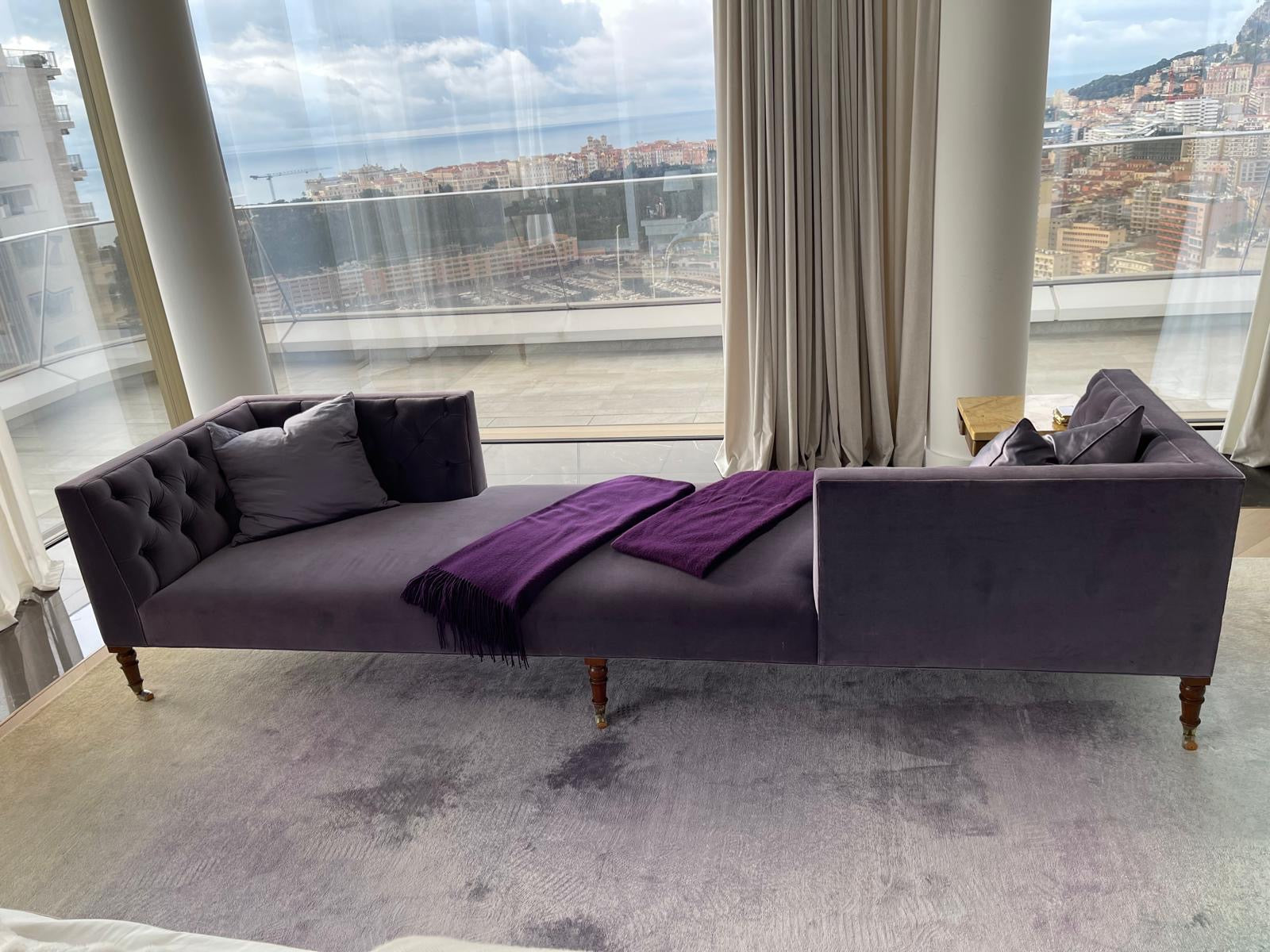 Purple velvet lounge sofa by Yvette Stokes, Casa Armani Reserve collection, showing plush upholstery and stylish design.